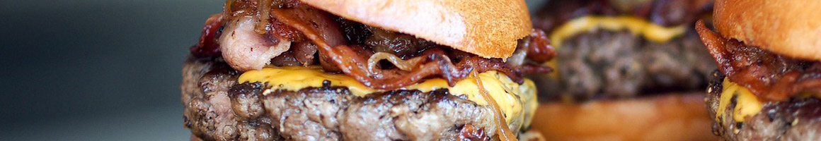 Eating Burger at Black Burger restaurant in New York, NY.